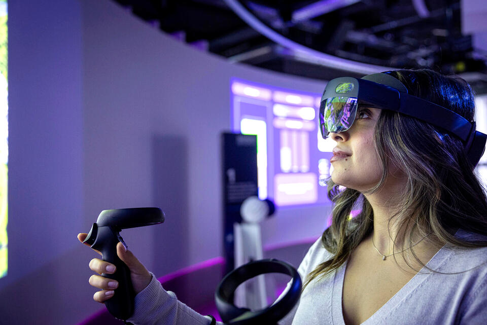 Three colleagues using VR in a meeting